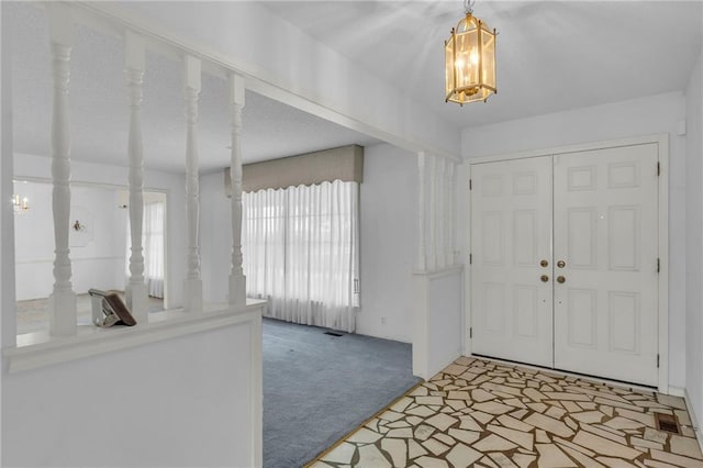 28210 Hedge Ln, Paola, KS 66071 - carpeted foyer entrance featuring a chandelier