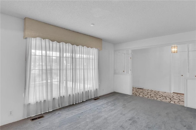 28210 Hedge Ln, Paola, KS 66071 - carpeted empty room featuring a textured ceiling