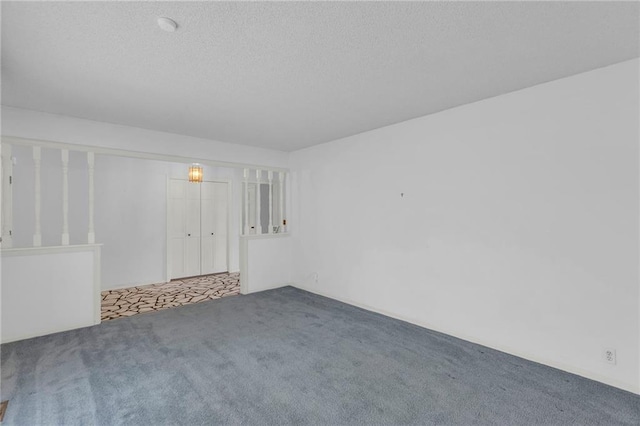 28210 Hedge Ln, Paola, KS 66071 - carpeted spare room featuring a textured ceiling
