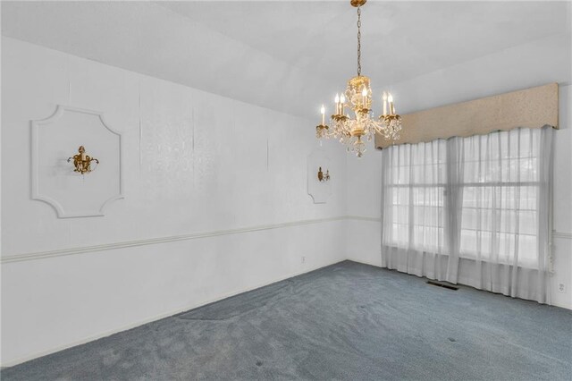 28210 Hedge Ln, Paola, KS 66071 - empty room featuring carpet floors and a chandelier