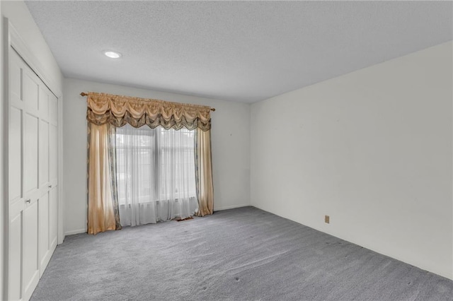 28210 Hedge Ln, Paola, KS 66071 - spare room with carpet, a textured ceiling, and recessed lighting