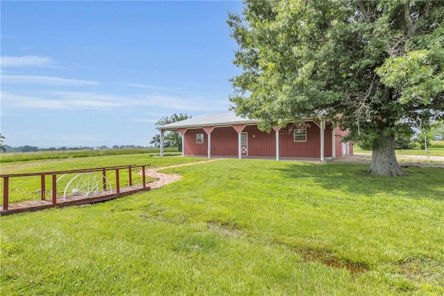 28210 Hedge Ln, Paola, KS 66071 - view of grassy yard featuring a pole building and an outbuilding