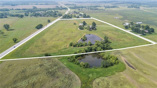 28210 Hedge Ln, Paola, KS 66071 - aerial view of property and surrounding area featuring rural landscape, a nearby body of water, and property parcel outlined
