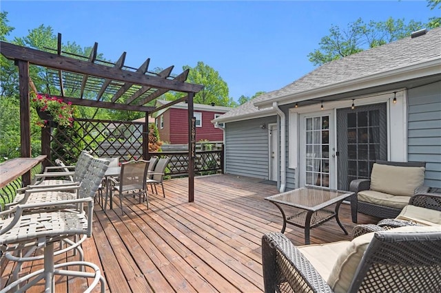wooden terrace with a pergola and outdoor dining space