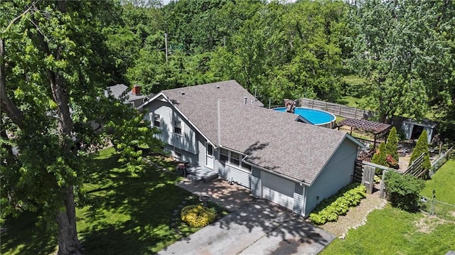 view from above of property featuring a heavily wooded area