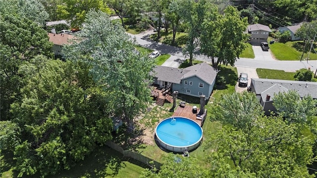 aerial view of residential area with a pool