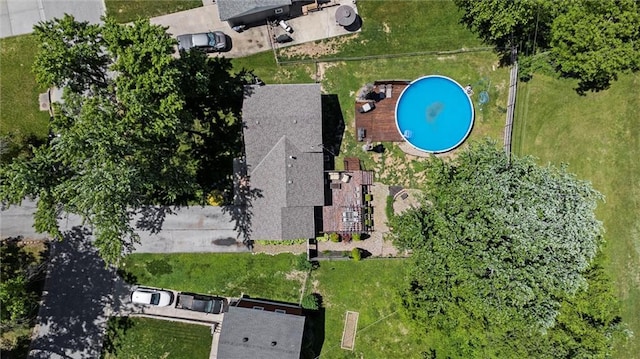 aerial view of property and surrounding area with a pool area