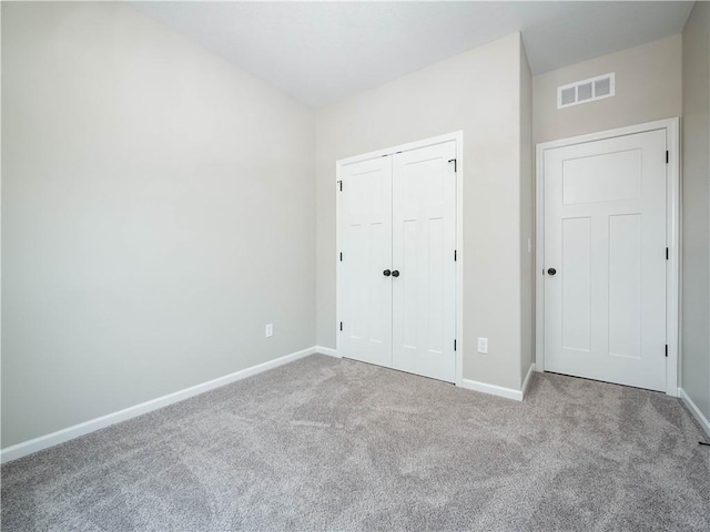 1313 N White Oaks Ln, Oak Grove, MO 64075 - unfurnished bedroom featuring carpet floors, baseboards, and a closet