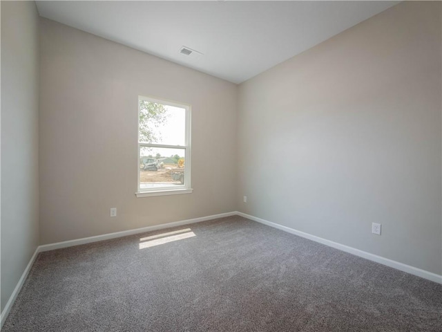 1313 N White Oaks Ln, Oak Grove, MO 64075 - empty room featuring carpet floors and baseboards