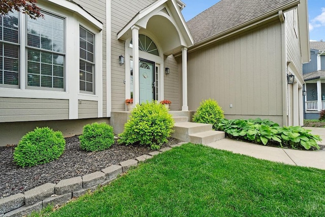 14263 W 129th Ter, Olathe, KS 66062 - property entrance featuring roof with shingles and a lawn