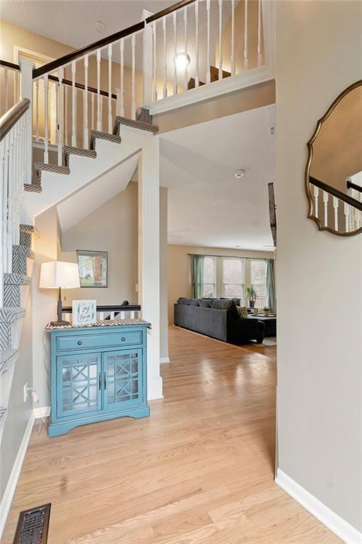 14263 W 129th Ter, Olathe, KS 66062 - stairway featuring wood finished floors and baseboards