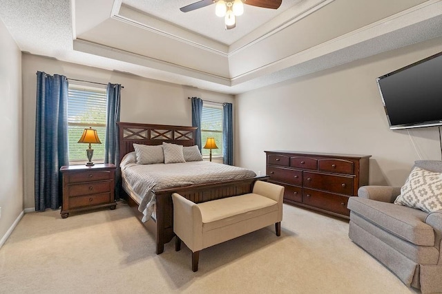 14263 W 129th Ter, Olathe, KS 66062 - bedroom featuring light colored carpet, a tray ceiling, multiple windows, and ceiling fan