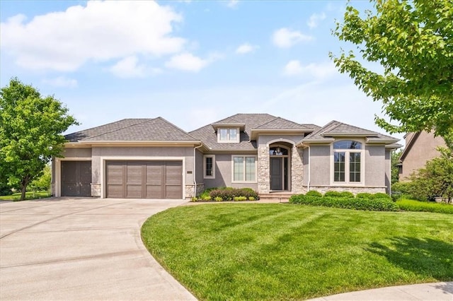 16456 Cody St, Overland Park, KS 66062 - view of front facade with stone siding, stucco siding, an attached garage, and a front lawn