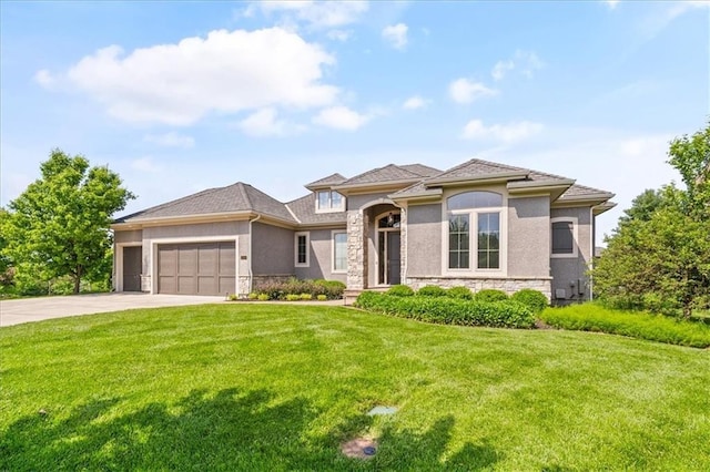 16456 Cody St, Overland Park, KS 66062 - prairie-style home with stone siding, an attached garage, driveway, stucco siding, and a front lawn