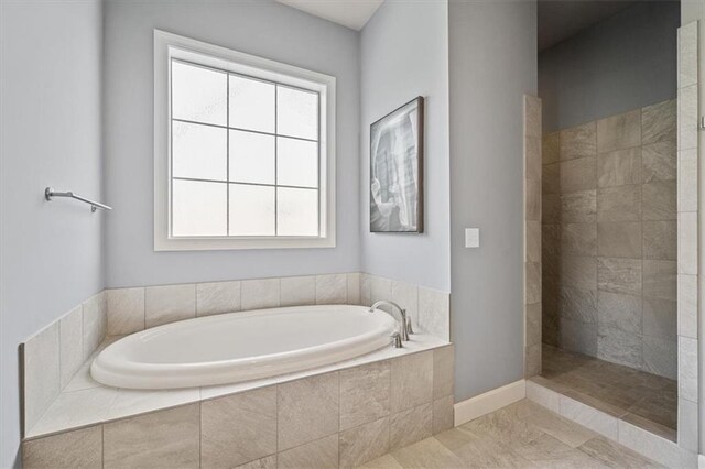 16456 Cody St, Overland Park, KS 66062 - bathroom featuring a bath and a walk in shower
