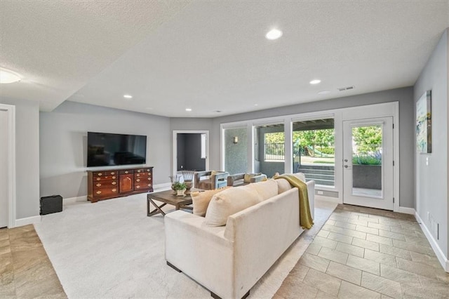16456 Cody St, Overland Park, KS 66062 - living area with a textured ceiling, recessed lighting, and baseboards