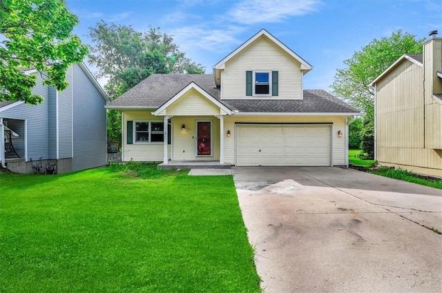 traditional-style house with a front lawn, concrete driveway, an attached garage, and a shingled roof