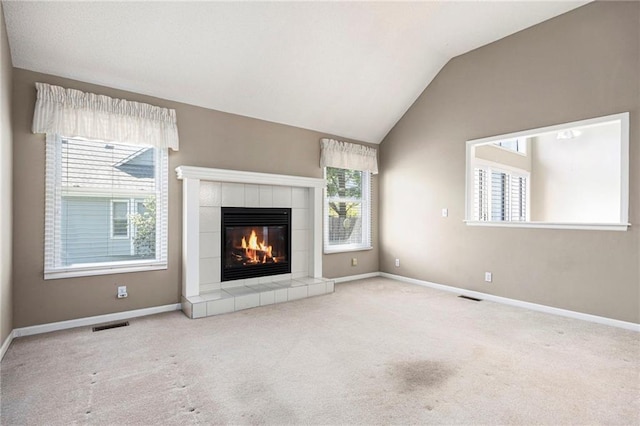 7001 W 157th Ter, Overland Park, KS 66223 - unfurnished living room featuring carpet floors, a fireplace, vaulted ceiling, and baseboards