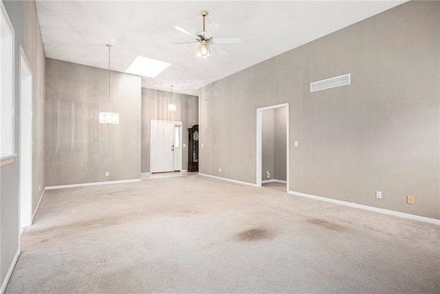7001 W 157th Ter, Overland Park, KS 66223 - empty room featuring ceiling fan, carpet, baseboards, and a chandelier