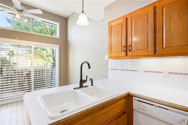 7001 W 157th Ter, Overland Park, KS 66223 - kitchen featuring dishwasher, a sink, decorative backsplash, ceiling fan, and light countertops