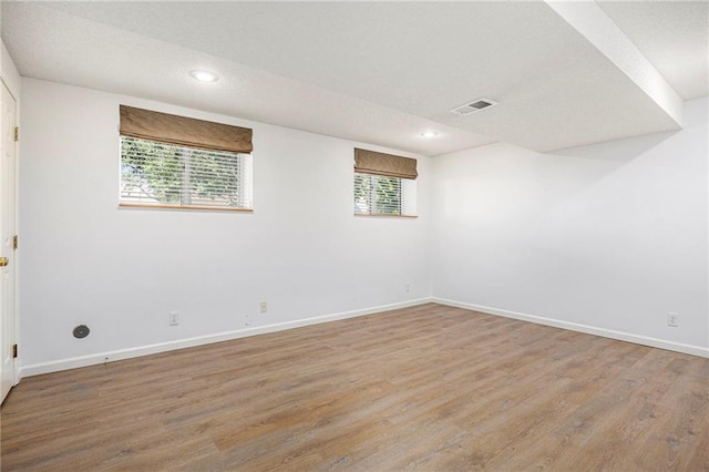 7001 W 157th Ter, Overland Park, KS 66223 - spare room with baseboards, light wood-style flooring, and recessed lighting