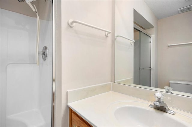 7001 W 157th Ter, Overland Park, KS 66223 - bathroom with a shower stall, vanity, and toilet