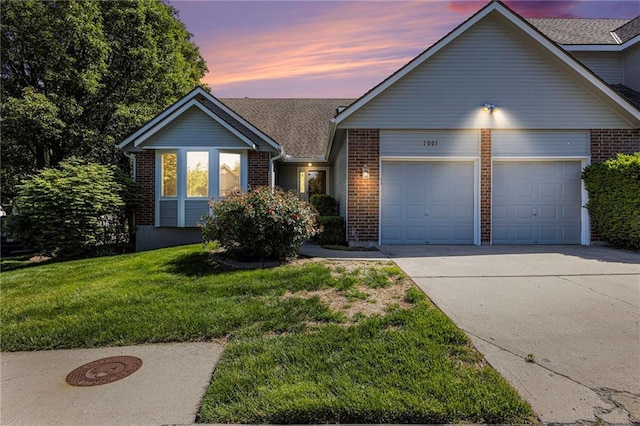 7001 W 157th Ter, Overland Park, KS 66223 - view of front of house with brick siding, an attached garage, concrete driveway, a front yard, and roof with shingles
