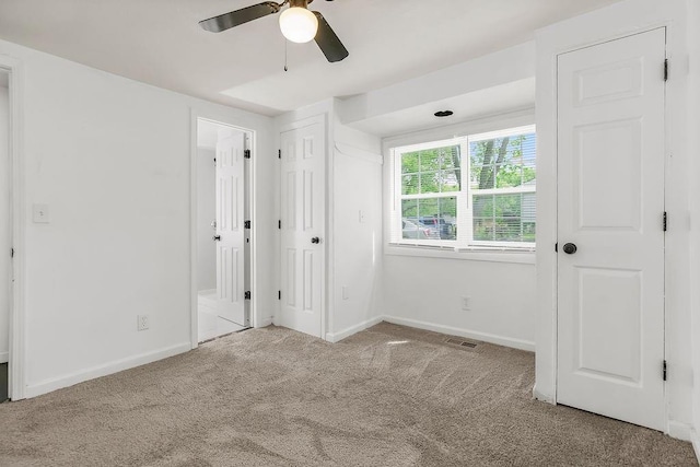 14213 S Haven Rd, Grandview, MO 64030 - unfurnished bedroom with carpet, baseboards, and ceiling fan