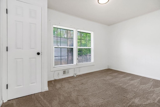 14213 S Haven Rd, Grandview, MO 64030 - carpeted spare room featuring baseboards