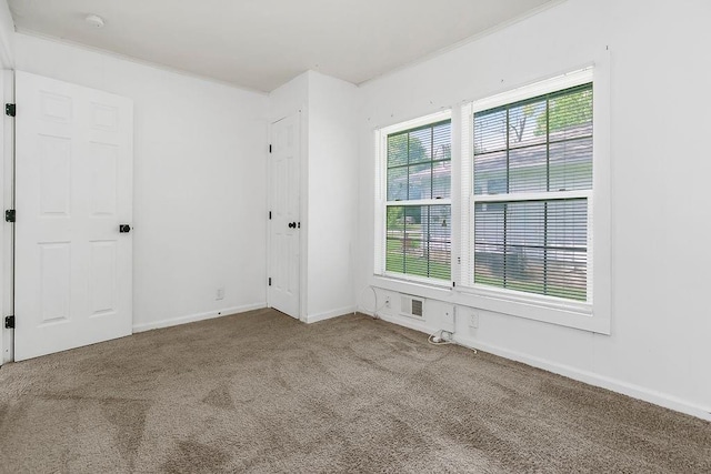 14213 S Haven Rd, Grandview, MO 64030 - carpeted empty room featuring ornamental molding and baseboards