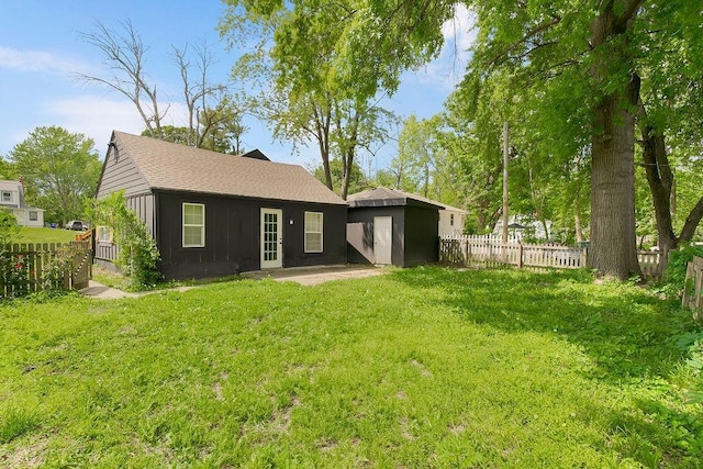 14213 S Haven Rd, Grandview, MO 64030 - rear view of property with a shingled roof