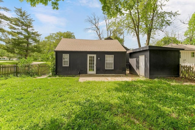 14213 S Haven Rd, Grandview, MO 64030 - back of house featuring an outdoor structure and roof with shingles
