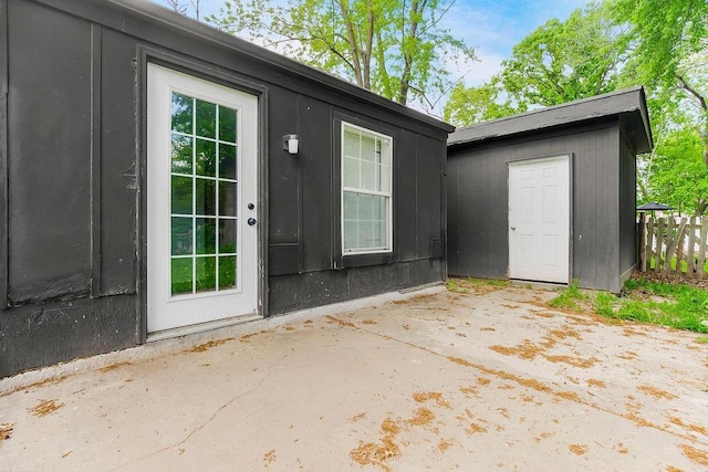 14213 S Haven Rd, Grandview, MO 64030 - view of exterior entry with a patio