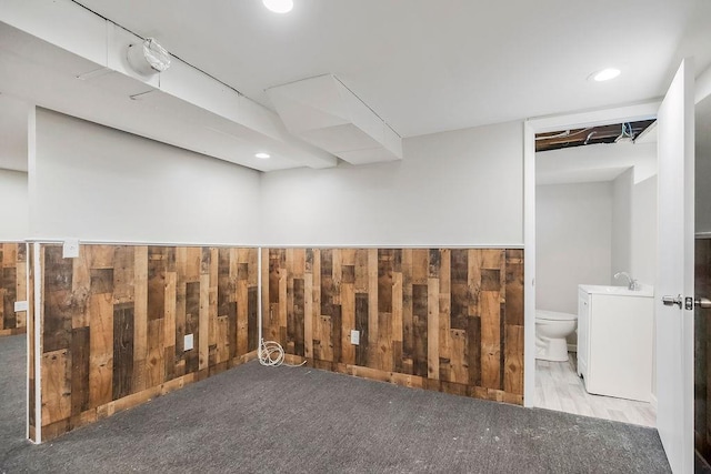 1924 N 75th Dr, Kansas City, KS 66112 - finished basement featuring wood walls and carpet