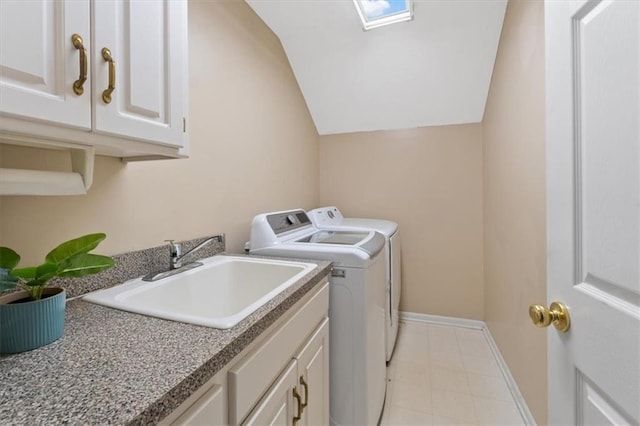 laundry area featuring washer and dryer, cabinet space, and baseboards