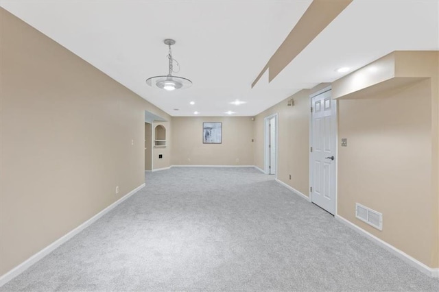 carpeted empty room with baseboards and recessed lighting