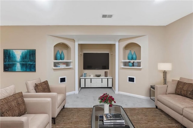 living area with carpet flooring and baseboards