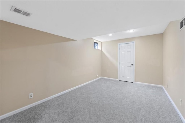 below grade area featuring carpet flooring, baseboards, and recessed lighting