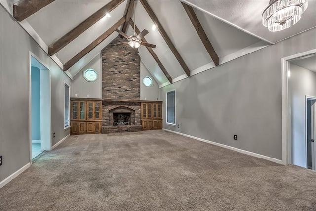529 SW Windmill Ln, Lees Summit, MO 64082 - unfurnished living room featuring ceiling fan, high vaulted ceiling, beam ceiling, carpet floors, and a brick fireplace