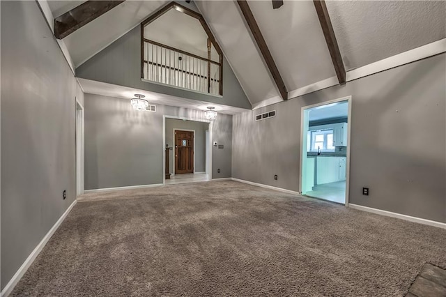 529 SW Windmill Ln, Lees Summit, MO 64082 - carpeted empty room featuring high vaulted ceiling, baseboards, and beam ceiling