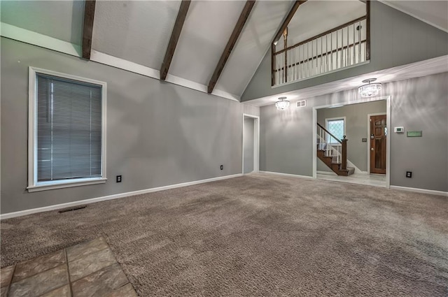 529 SW Windmill Ln, Lees Summit, MO 64082 - unfurnished living room with high vaulted ceiling, stairway, beamed ceiling, baseboards, and carpet floors