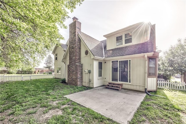 529 SW Windmill Ln, Lees Summit, MO 64082 - rear view of house featuring roof with shingles, a patio, entry steps, board and batten siding, and a chimney