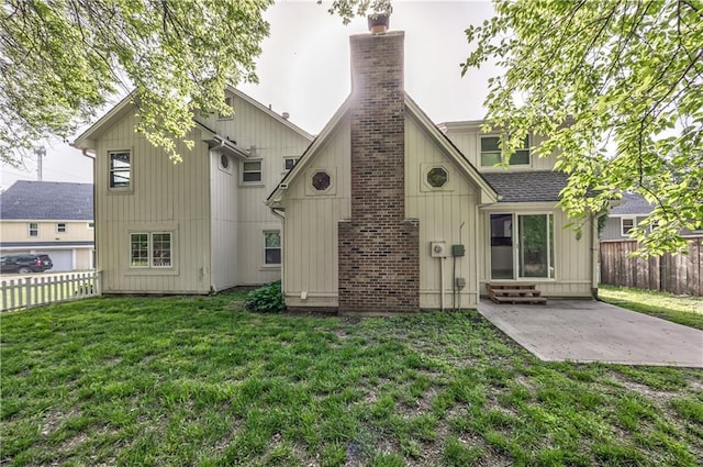 529 SW Windmill Ln, Lees Summit, MO 64082 - rear view of property featuring a chimney, a patio area, and entry steps