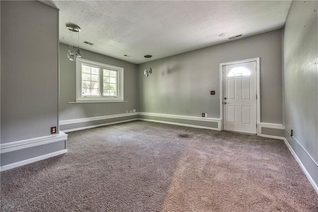 529 SW Windmill Ln, Lees Summit, MO 64082 - carpeted spare room with a textured ceiling and baseboards