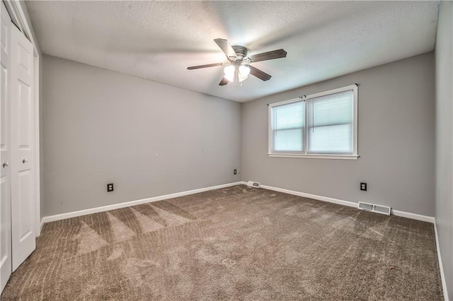 529 SW Windmill Ln, Lees Summit, MO 64082 - carpeted spare room featuring ceiling fan, baseboards, and a textured ceiling