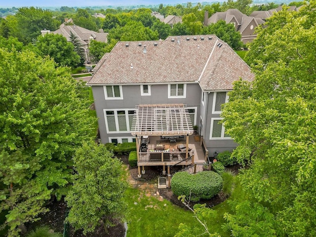 6104 W 144th St, Overland Park, KS 66223 - rear view of property with stucco siding, a wooden deck, and a pergola
