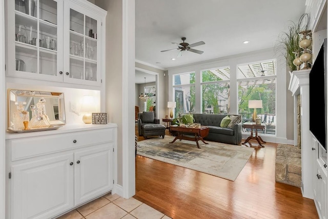 6104 W 144th St, Overland Park, KS 66223 - living room with ceiling fan, light wood-style floors, and recessed lighting