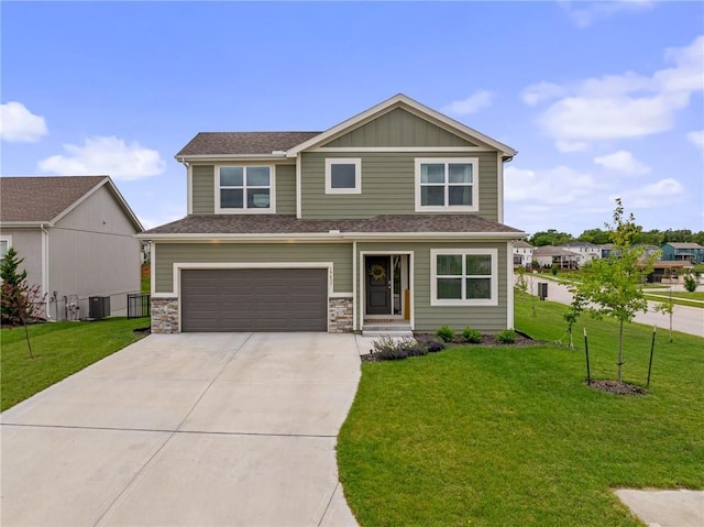 19637 W 196th St, Spring Hill, KS 66083 - view of front facade with driveway, an attached garage, a front lawn, and board and batten siding