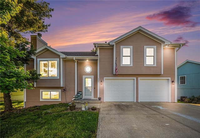 305 Crimson Ct, Cameron, MO 64429 - view of front of property with a garage, driveway, a chimney, and a front yard