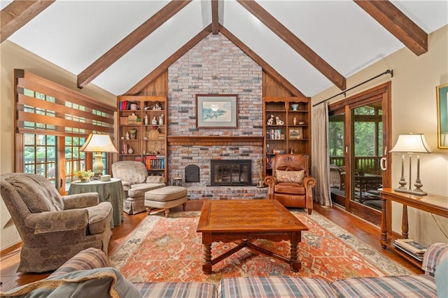 20129 W 112th Cir, Olathe, KS 66061 - living room with wood finished floors, built in shelves, and a fireplace